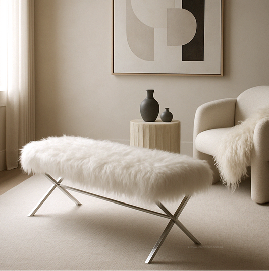 Minimalist living room with white faux fur bench, modern armchair, wooden side table, abstract wall art