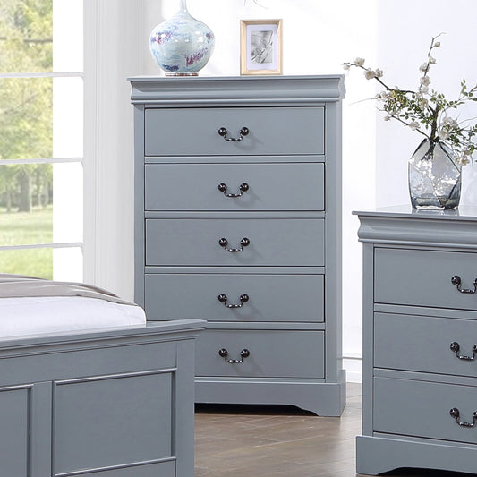 Gray wooden chest of drawers in a bright bedroom with decorative vase and picture frame